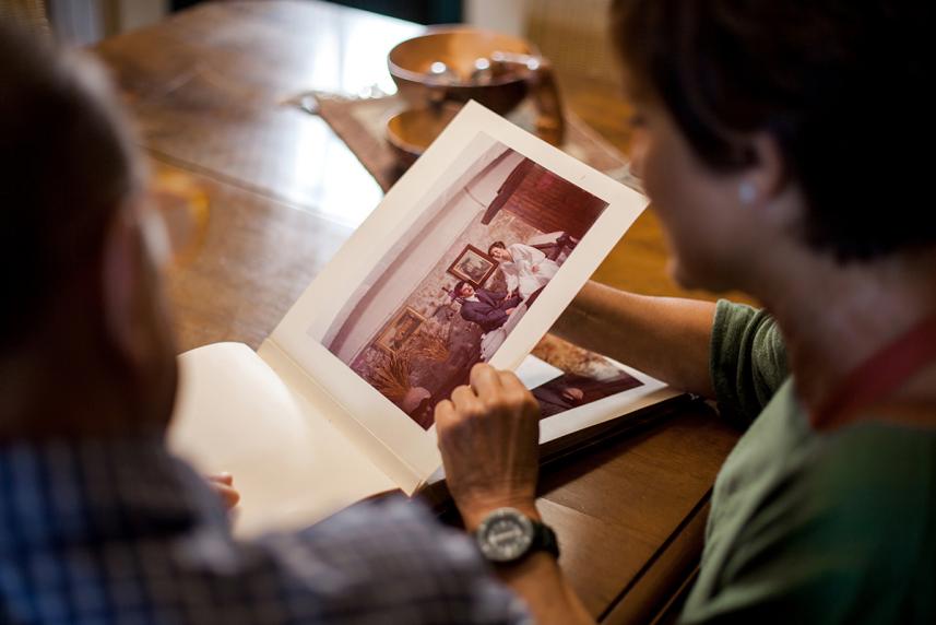 A couple looking through a photo album of memories