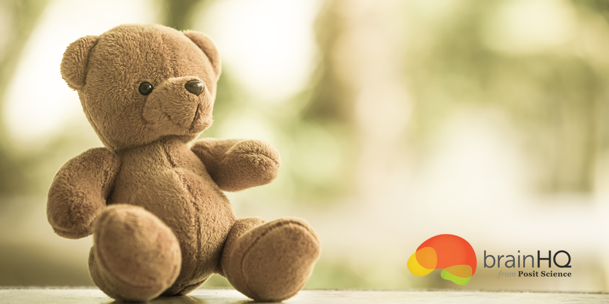 infant-1200×600-1 A brown teddy bear sitting on top of a table