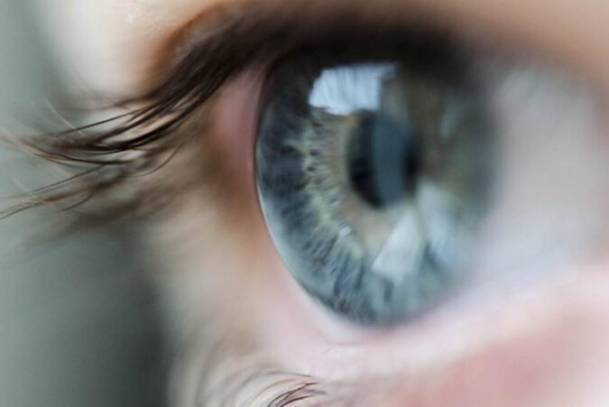 A close up of a person's blue eye