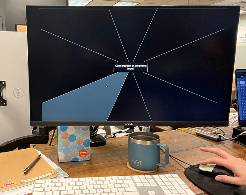 A computer monitor sitting on top of a desk