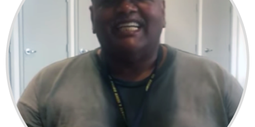 reggie-m A man in a baseball cap is smiling