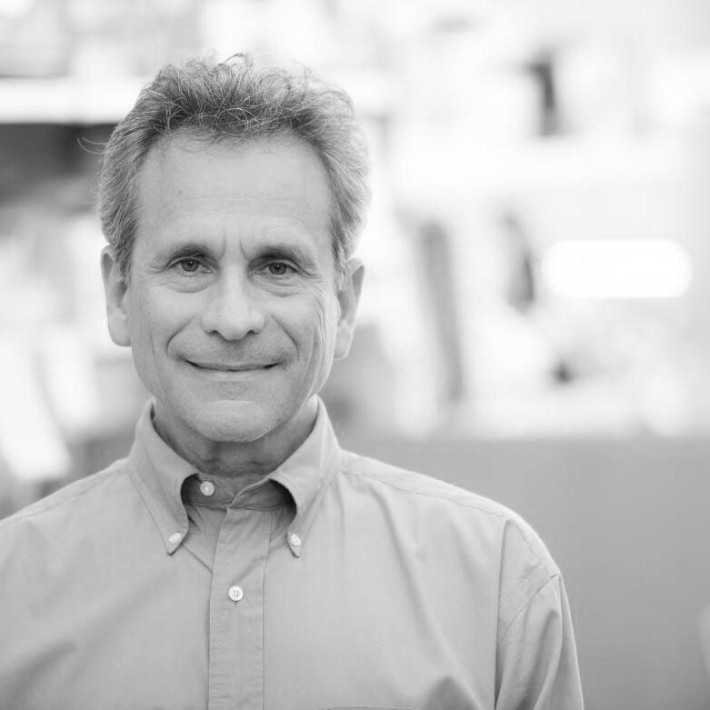 A black and white photo of Dr. John Rubenstein