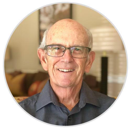 An older man wearing glasses and a blue shirt