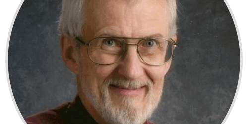 stories-ron A man with glasses and a beard smiling