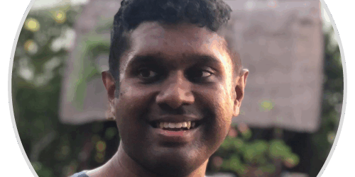 testimonial-dulesh A man smiling in a circle with a house in the background