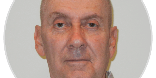 testimonials-george-b A man with a bald head wearing a white shirt