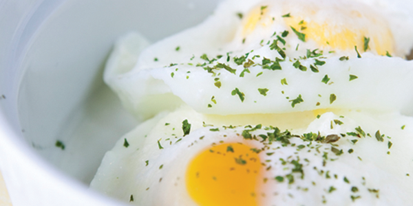 bcream A bowl of food with an egg on top of it