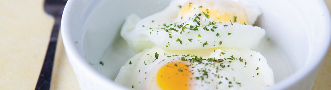 A bowl of food with an egg on top of it