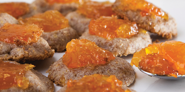 A close up of a spoon with food on it