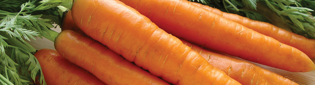 A bunch of carrots sitting on top of a table