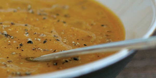 cginger A bowl of soup with a spoon in it