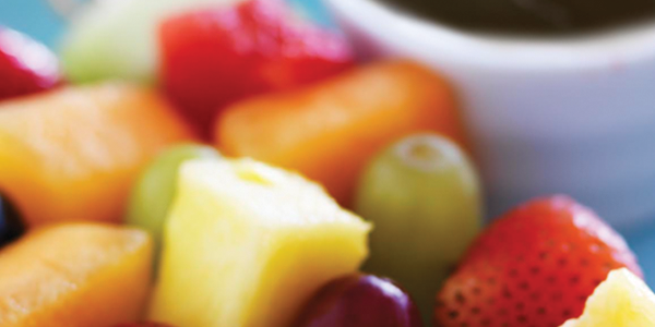 choco_0 A close up of a plate of fruit on a table