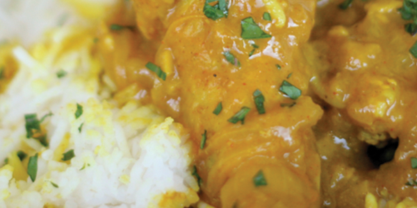 ichicken A close up of a plate of food with chicken and rice