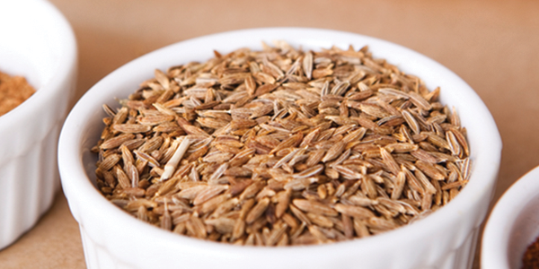 murgh A couple of white bowls filled with different types of food