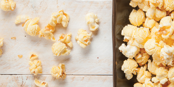 popcorn_1 A pan filled with popcorn sitting on top of a counter