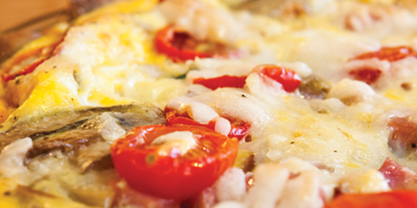 potato A close up of a pizza with tomatoes and cheese