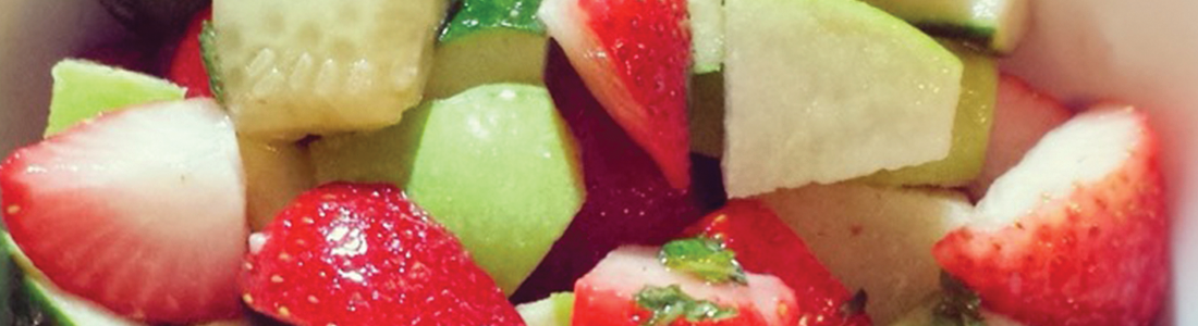 A close up of a fruit salad in a bowl