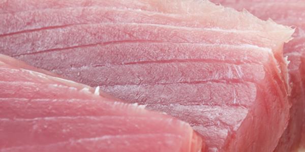 A close up of raw meat on a cutting board