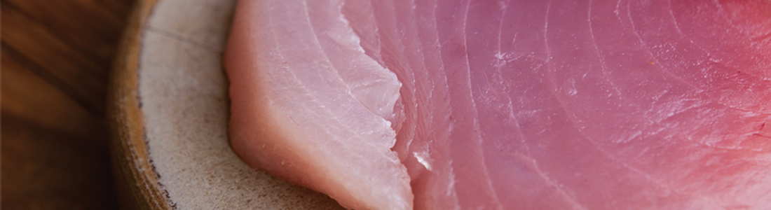 A close up of a piece of meat on a plate