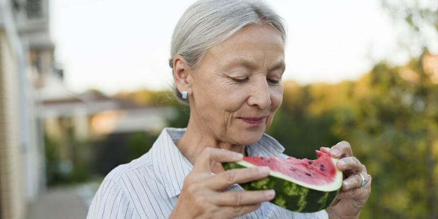 B1_FoodBrainHealth_1125579766_29 (1) An older woman eating a piece of watermelon