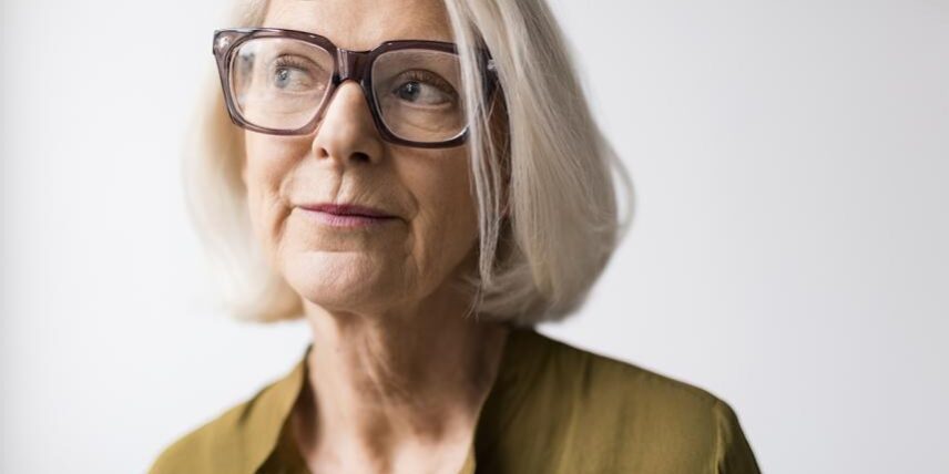 B5_Quiz_688893737_7 An older woman wearing glasses and a green shirt