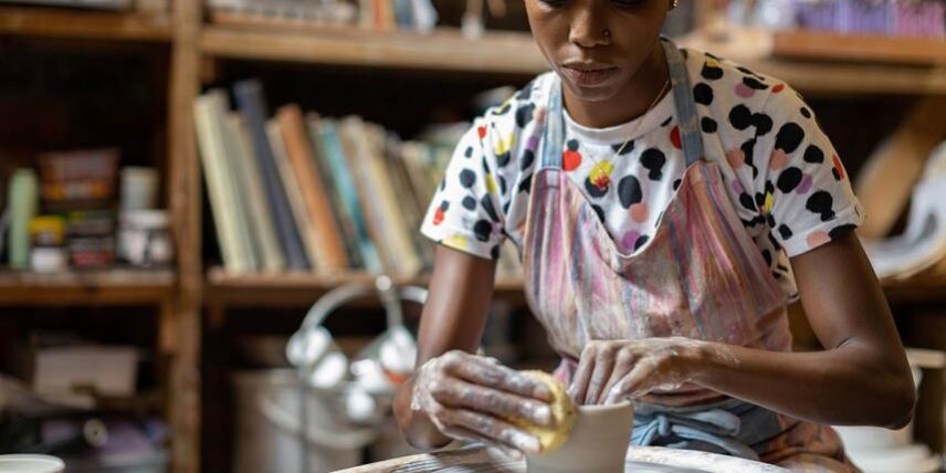 Brain101_1389419381_6 A woman is making a vase out of clay