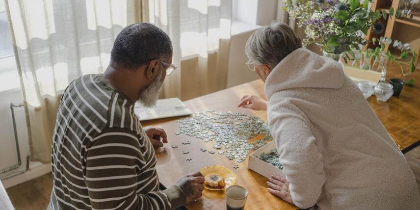 B1_10habits_1402215727_34 (1) A man and woman sitting at a table playing a game
