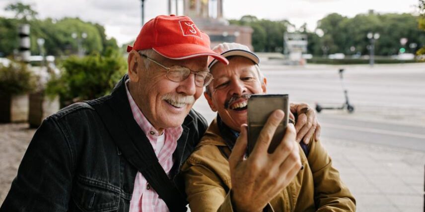PS_Traveling-1288668811_1 A man taking a selfie with another man